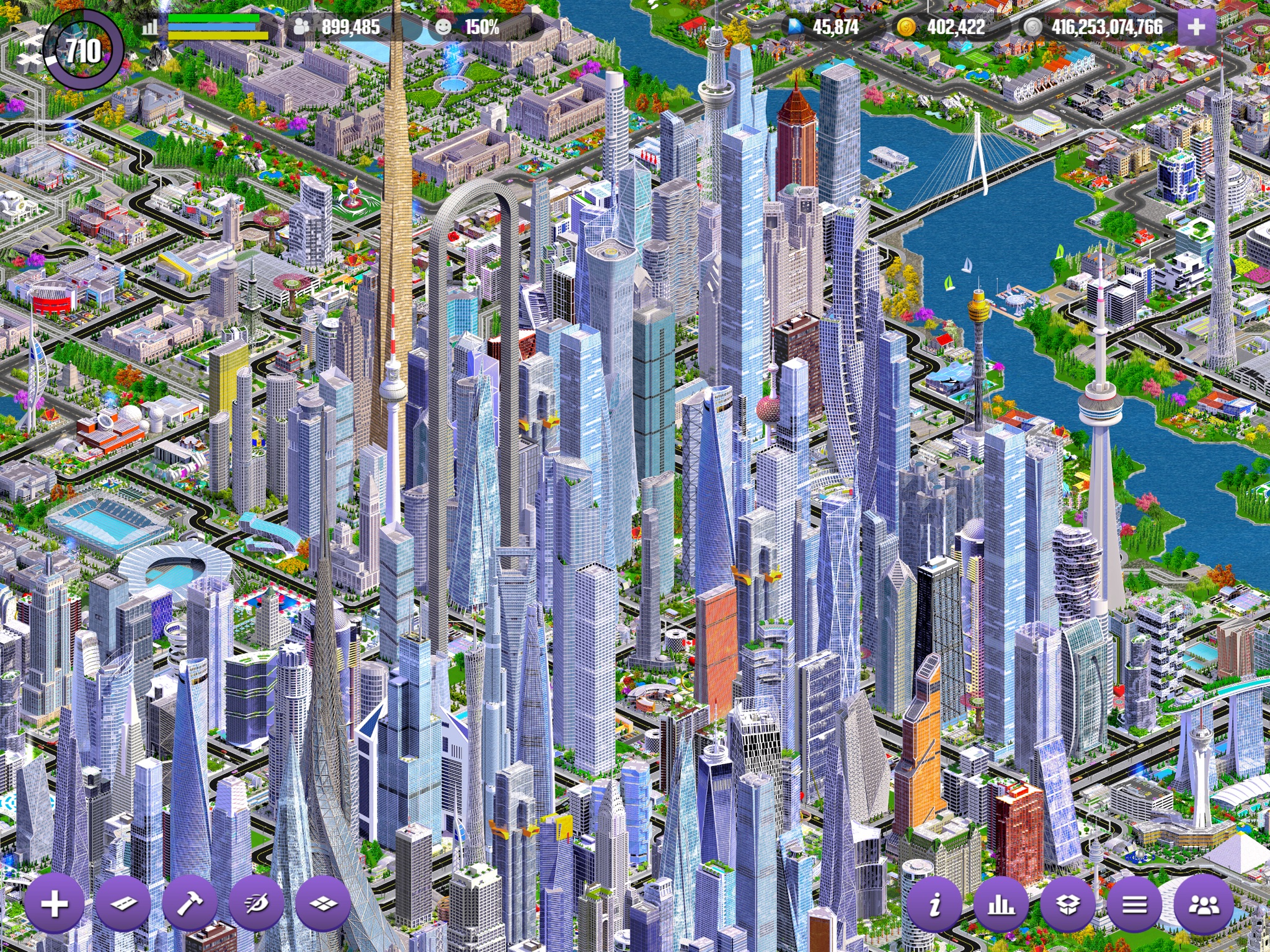 Designer City build view with high-rise blocks, parks and road grid on tablet